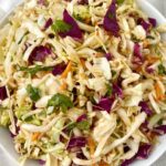 overhead shot of Sweet Spicy Vinegar Based Coleslaw in a white bowl