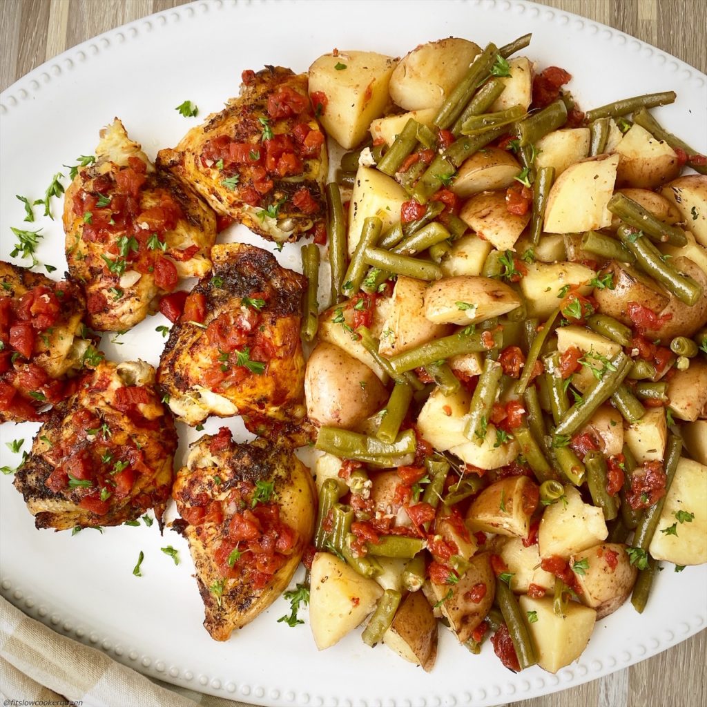 italian chicken dinner on a big white plate