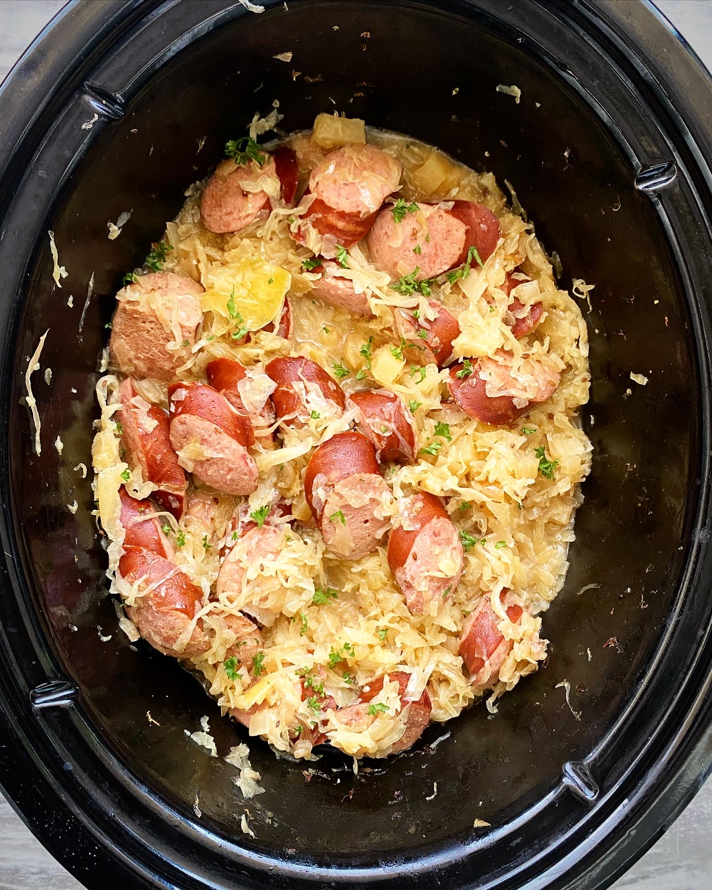 cooked Slow Cooker Sausage & Sauerkraut in the slow cooker