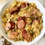 overhead shot of Sausage & Sauerkraut in a white bowl
