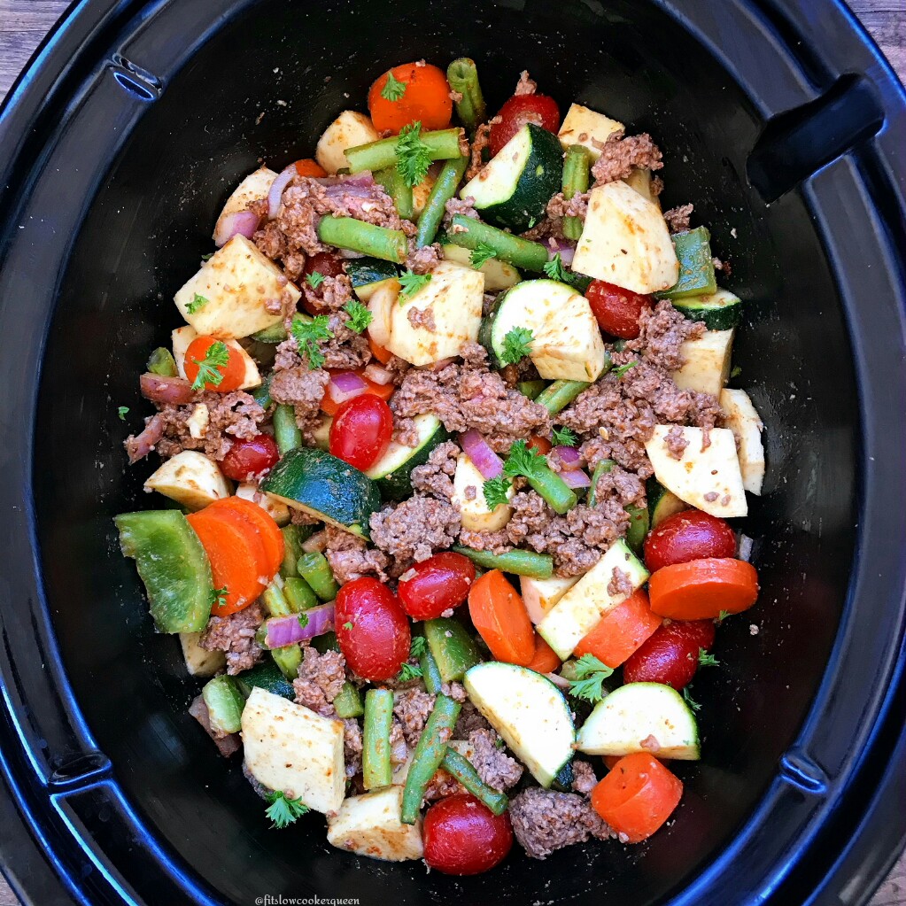 Load this slow cooker paleo pot with protein, sweet potatoes, veggies, & a homemade spice blend. This easy one-pot recipe can also be made vegetarian.