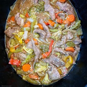 Healthy beef stir-fry made in the slow cooker or Instant Pot! This paleo, whole30, and gluten-free recipe is healthy but still has the flavors of your take-out.
