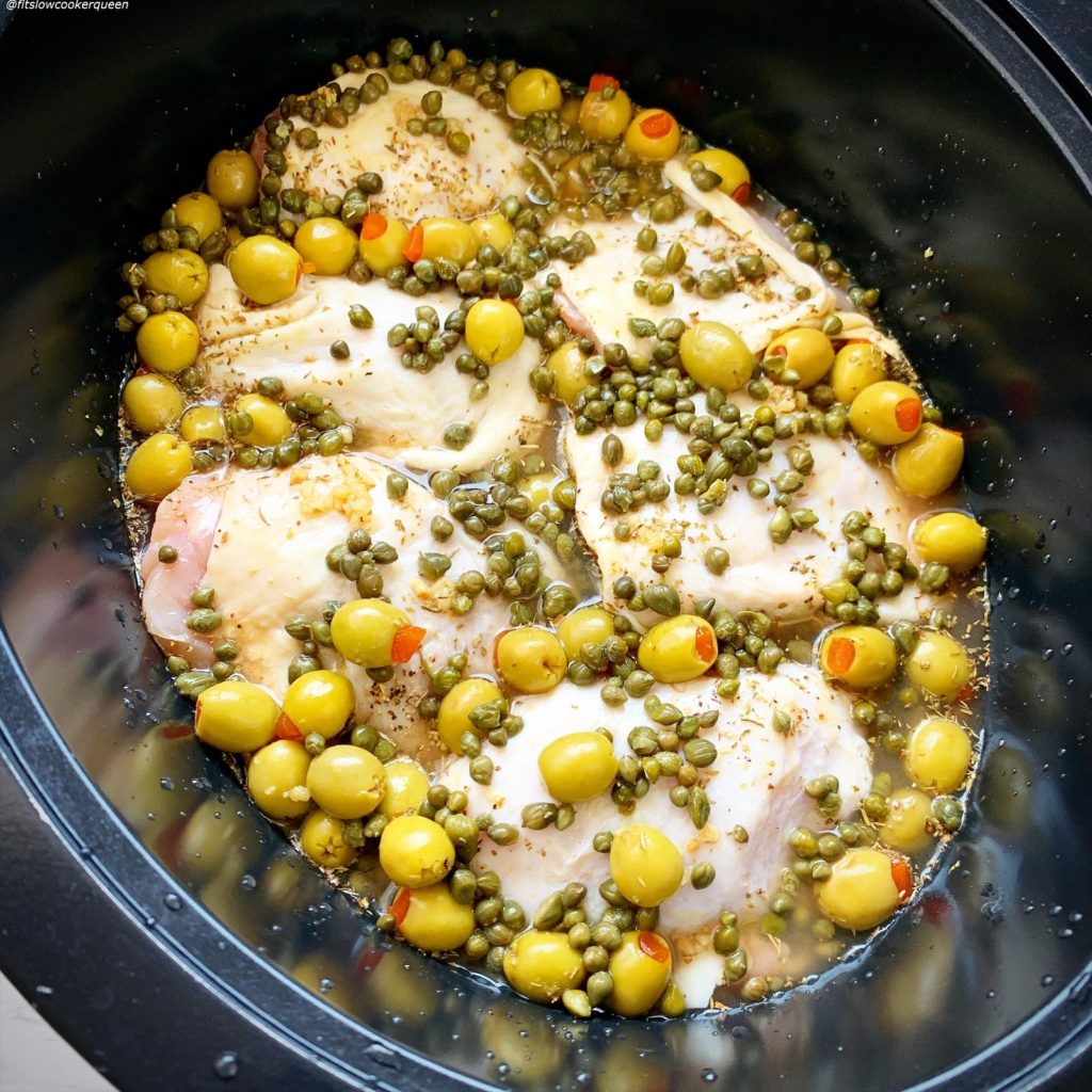 before pic of raw food in the slow cooker for Slow Cooker Instant Pot Chicken, Olives & Capers (Low-Carb, Paleo, Whole30)