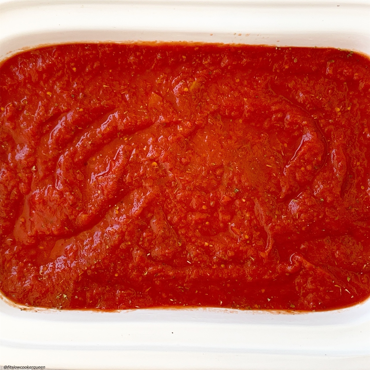sauce on top of the stuffed manicotti in the slow cooker for for slow cooker or instant pot stuffed manicotti