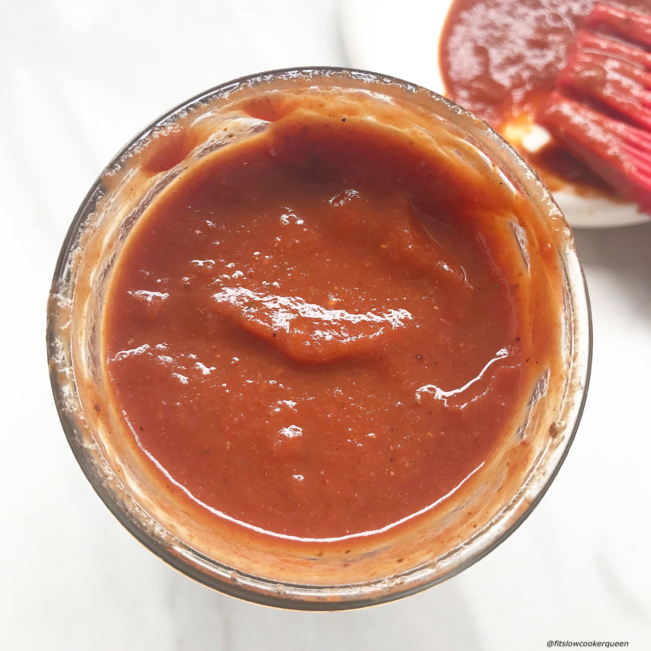 This tangy, homemade slow cooker BBQ sauce is sugar-free, gluten-free, whole30 compliant, and paleo but still packed with flavor.