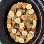overhead shot of cooked Banana Blueberry French Toast in a black slow cooker