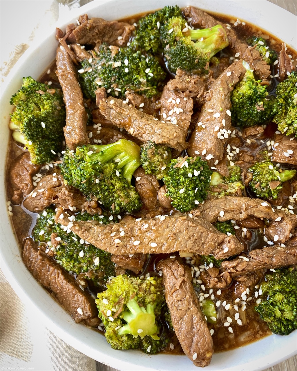 close up, side view of cooked beef & broccoli in a bowl