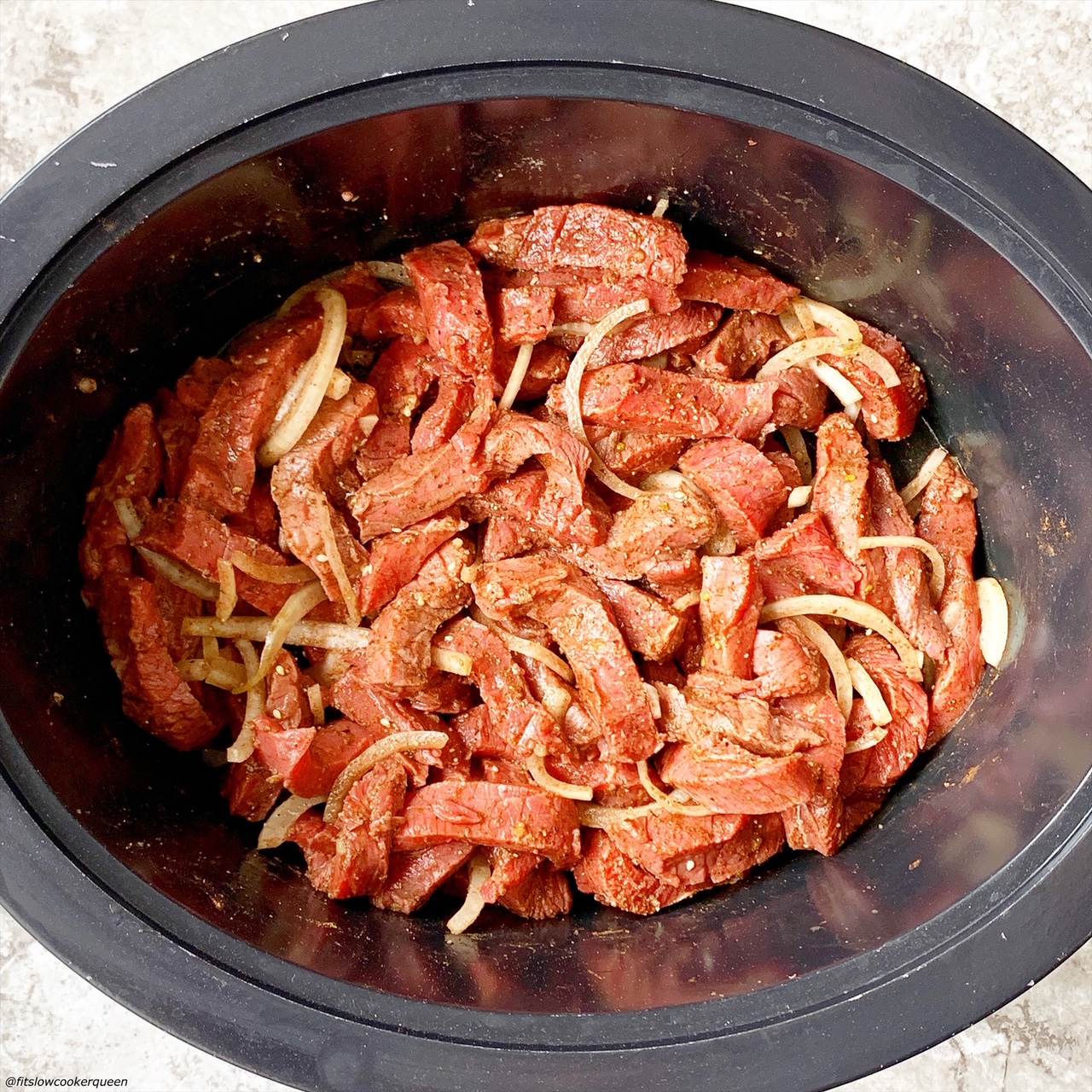 beef shawarma in the slow cooker before being cooked