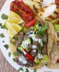 close up shot of slow cooker beef shawarma in a pita
