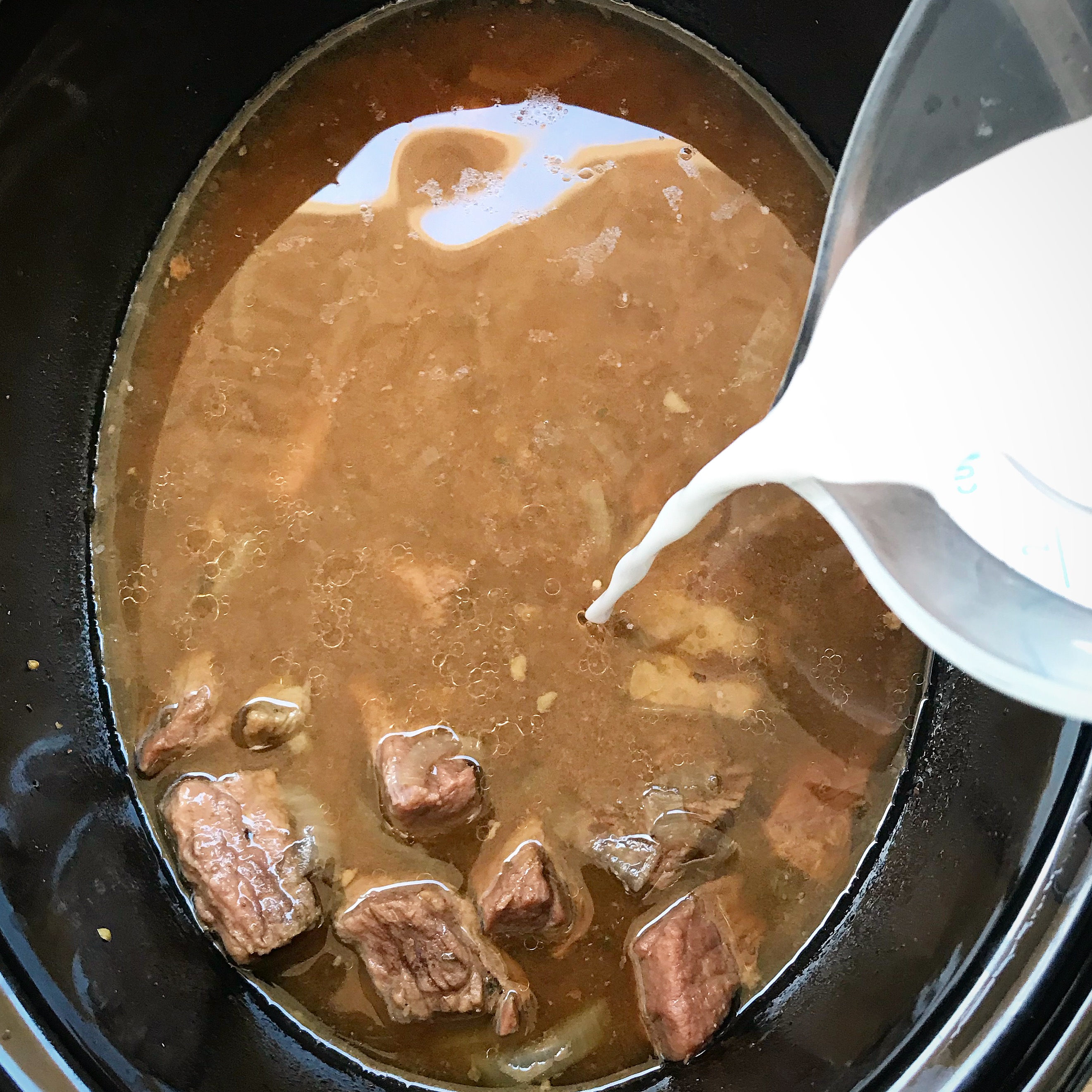 Beef tips cook with a homemade gravy in this slow cooker recipe. Comfort food made healthy! This recipe is both paleo and whole30 compliant.