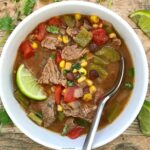 This recipe takes carne asada flavors and turns them into a soup. Flavorful and filling, this slow cooker soup is super easy and healthy too.