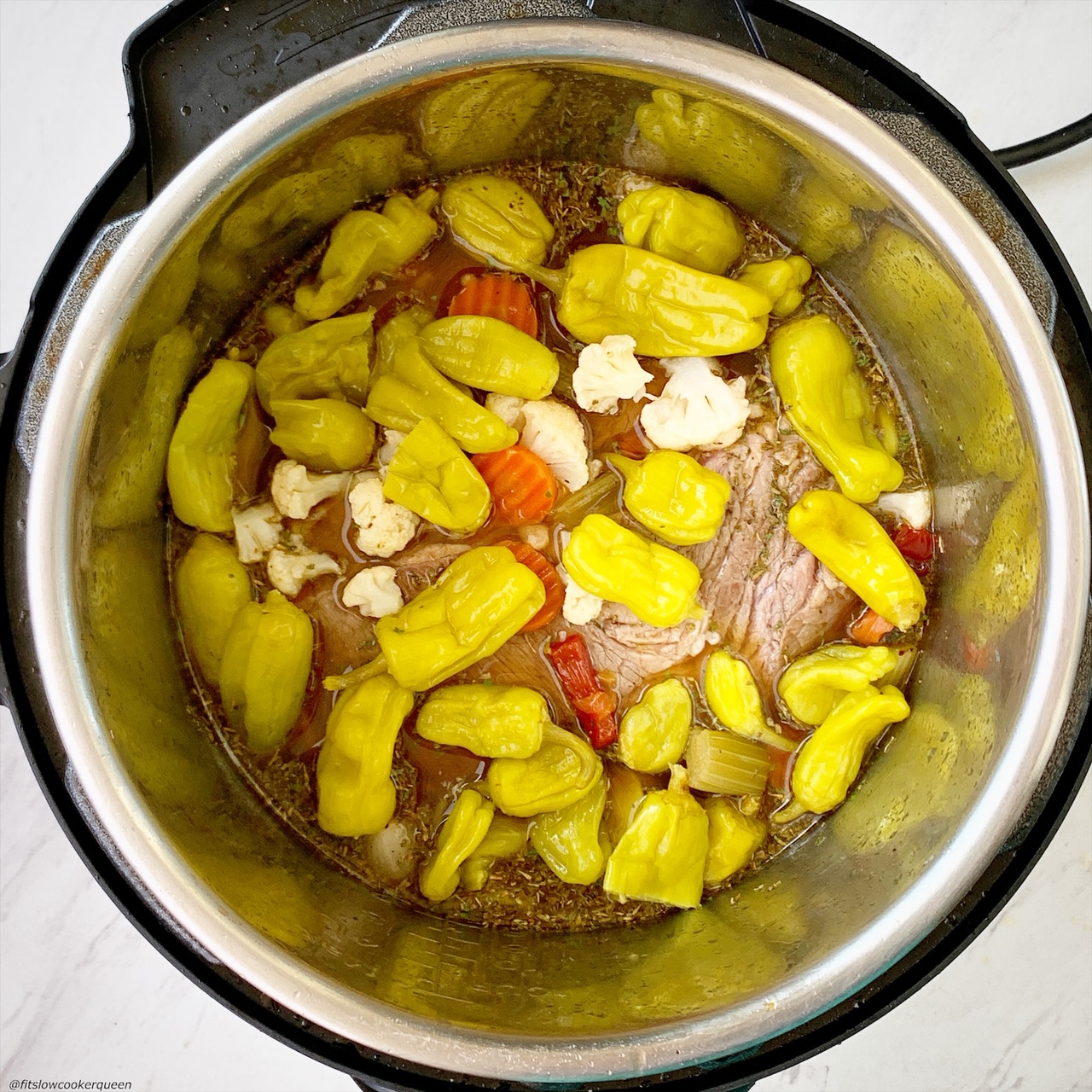 before pic of italian beef in the instant pot with pepperoncini pepperes & giardineria