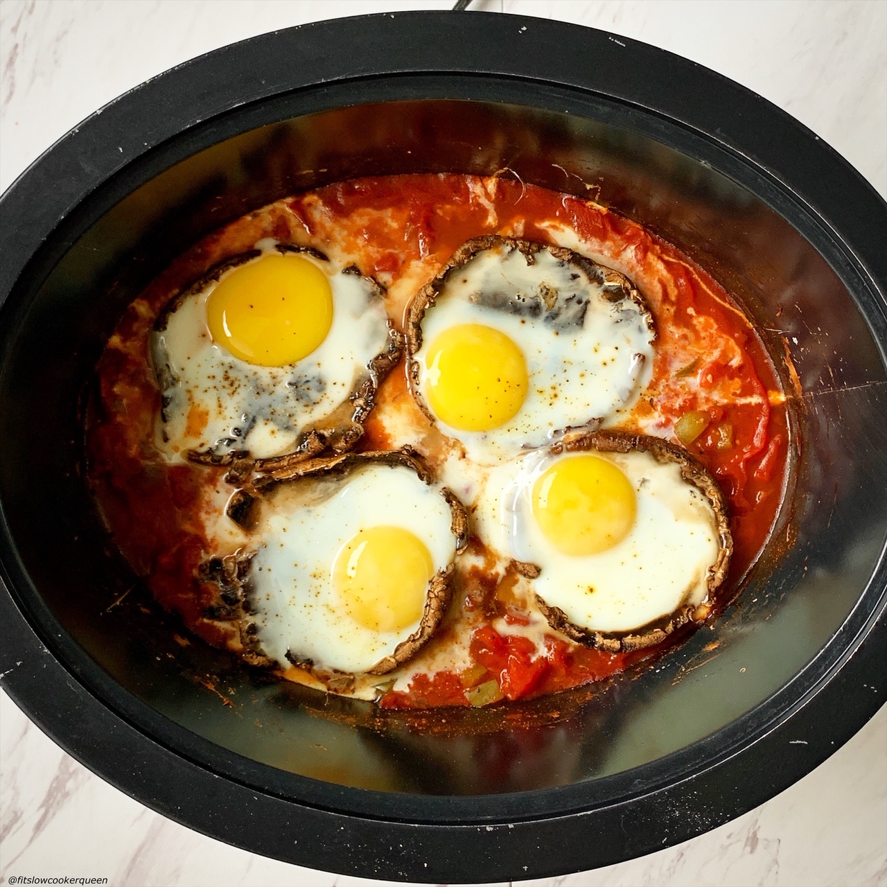 cooked eggs added on top of cooked portobello mushrooms in the slow cooker