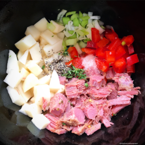 This slow cooker breakfast casserole uses leftover corned beef and potatoes (corned beef and hash) along with whatever vegetables you want to add in. Even though it's egg-based, this tasty meal that can be served for breakfast, lunch, or dinner.