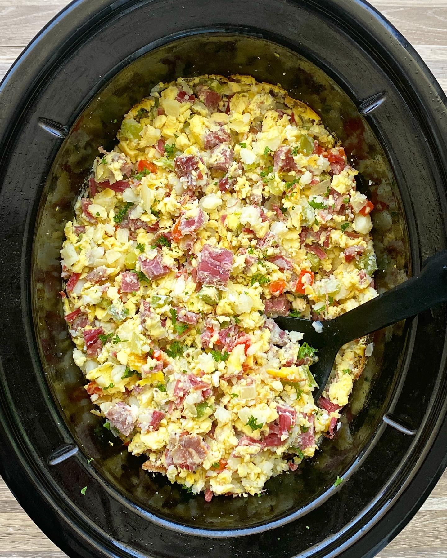 cooked corned beef hash in the slow cooker, scrambled