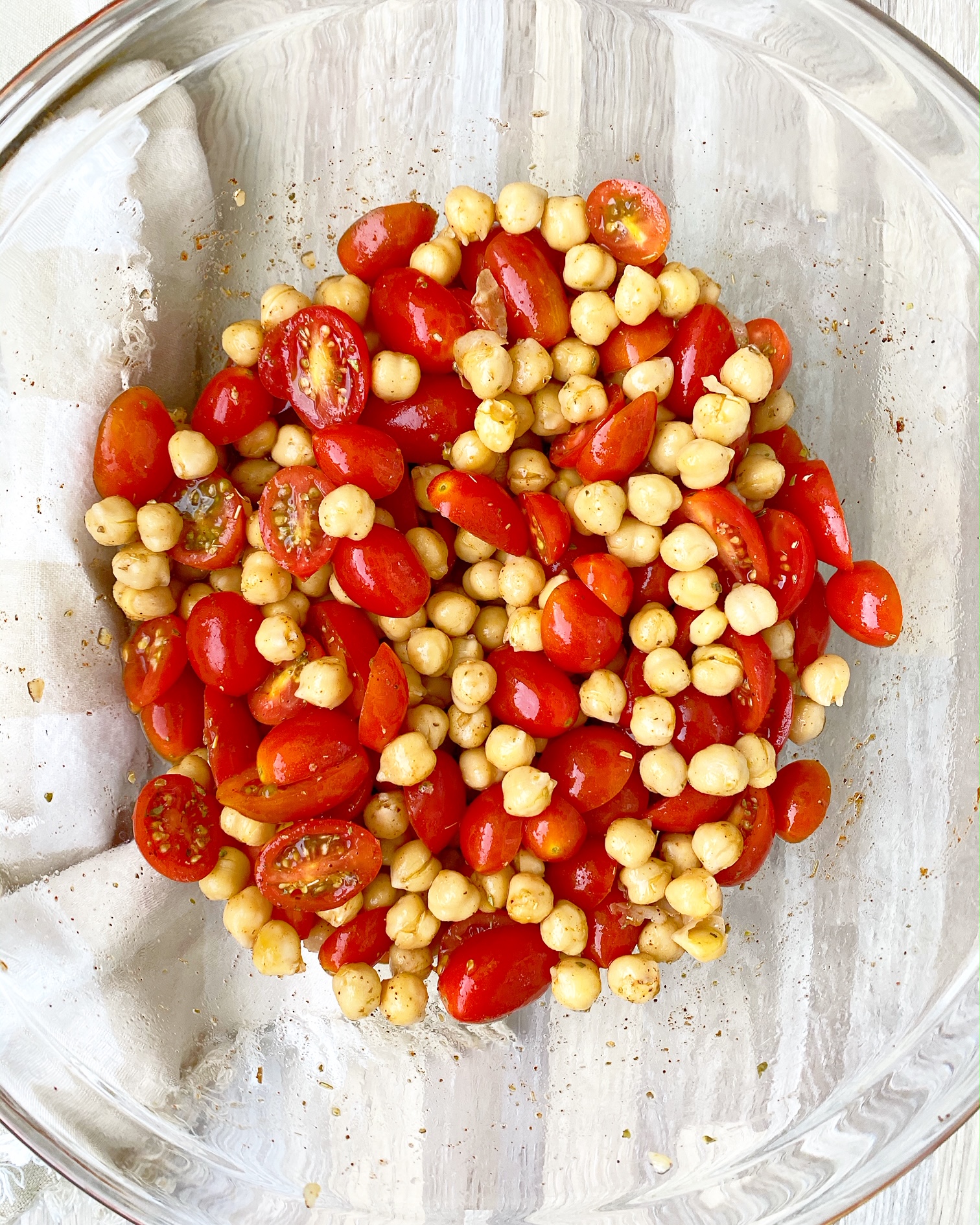 tomatoes, chickpeas, seasonings, lemon juice, and broth in a large clear bowl