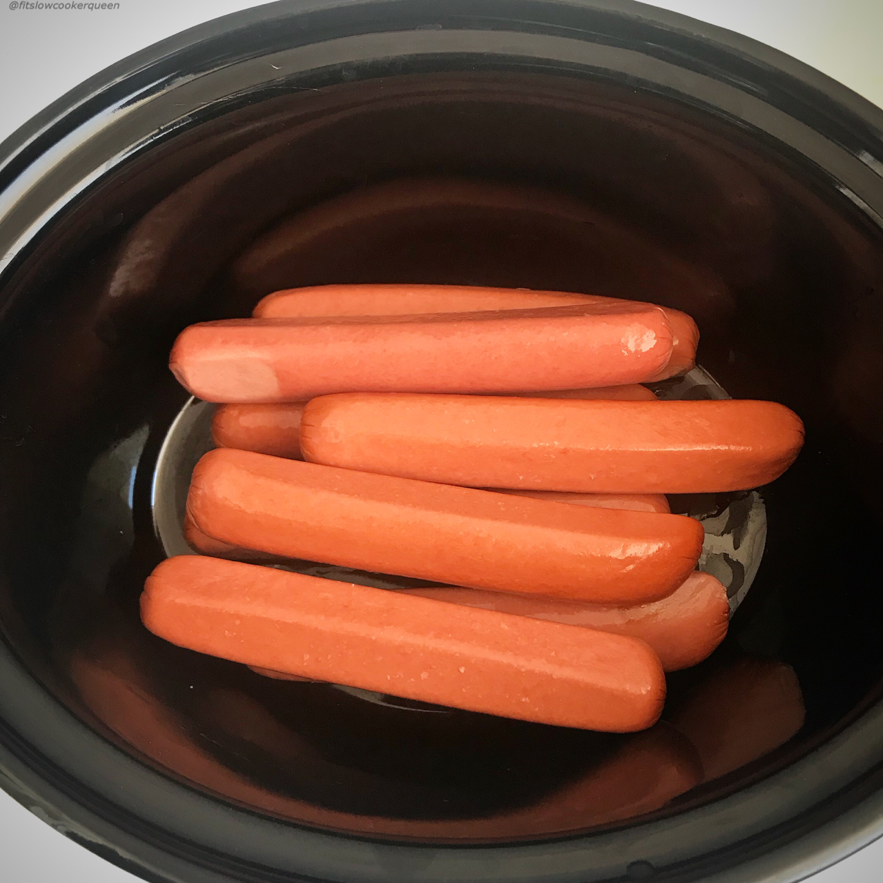 If you love steamed, 'ballpark' style hot dogs then throw them in your slow cooker! Perfect for feeding a crowd, this 1-ingredient recipe couldn't get any easier.