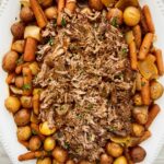 overhead shot of up of balsamic Dijon pot roast on a white serving platter