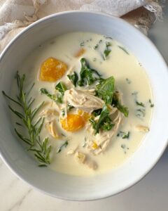 overhead shot of Crockpot Chicken Butternut Squash Soup in a white bowl