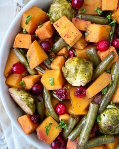 close up shot of cooked harvest vegetables in a large white bowl