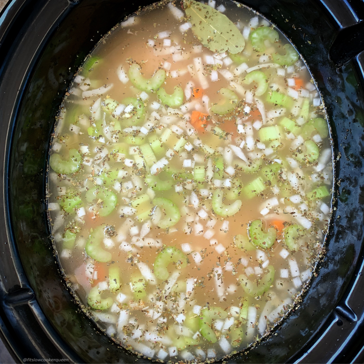 before pic of uncooked chicken soup in the slow cooker