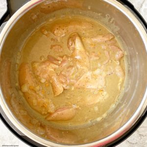 pic of raw chicken in the pressure cooker for Slow CookerInstant Pot Caribbean Chicken Curry (Low-Carb,Paleo,Whole30) (2)