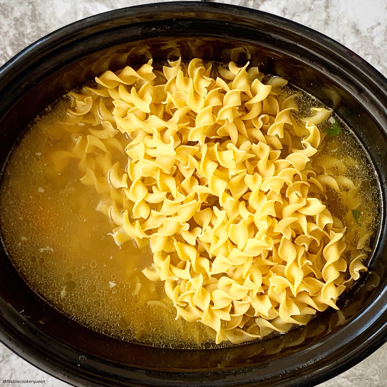 add uncooked noodles to the slow cooker for chicken noodle soup
