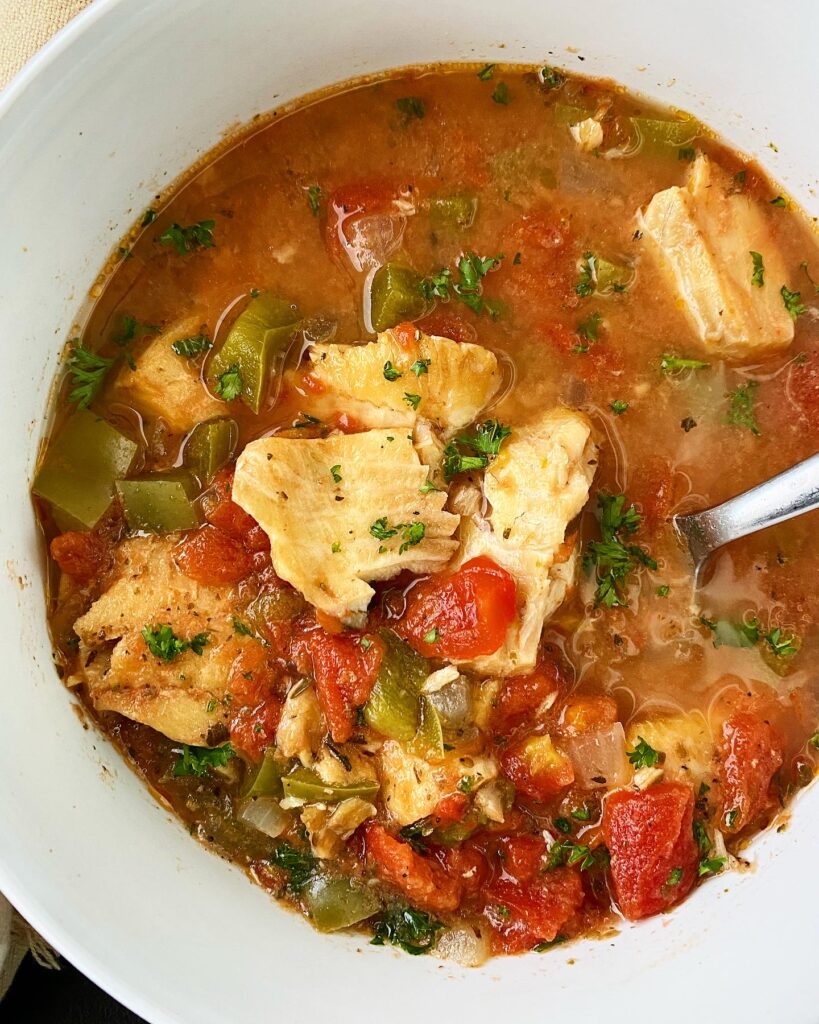 overhead shot of Slow Cooker Mediterranean Fish Stew in a white bowl