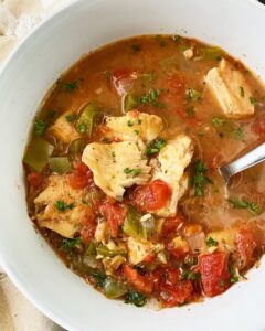 overhead shot of Slow Cooker Mediterranean Fish Stew in a white bowl