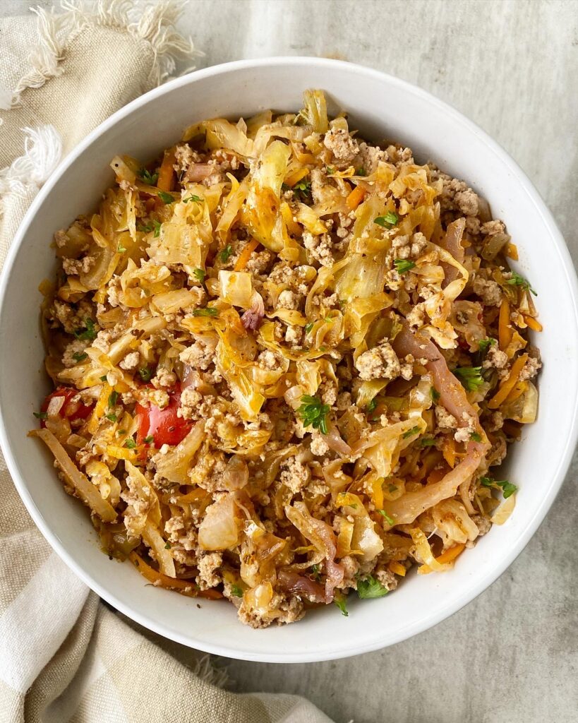 overhead shot of spicy turkey slaw in a white bowl
