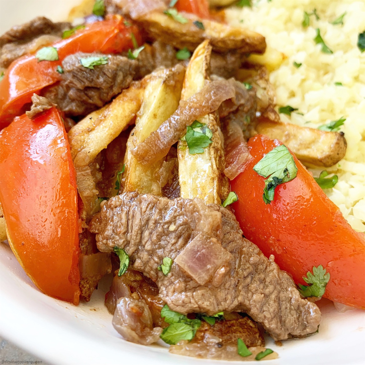 Lomo saltado is Peruvian dish that combines beef stir-fry, french fries and rice. Make this paleo/whole30 version in your slow cooker or Instant Pot.