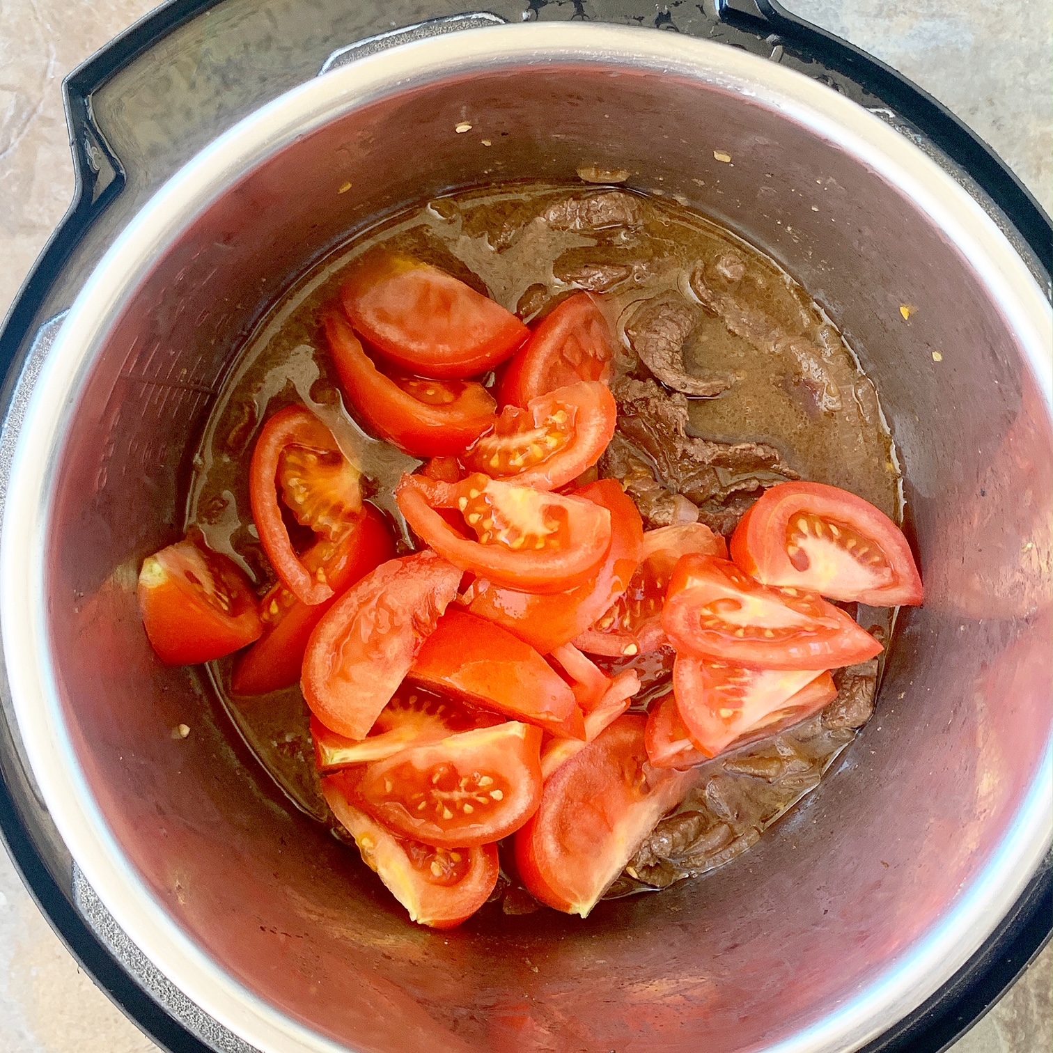 Lomo saltado is Peruvian dish that combines beef stir-fry, french fries and rice. Make this paleo/whole30 version in your slow cooker or Instant Pot.