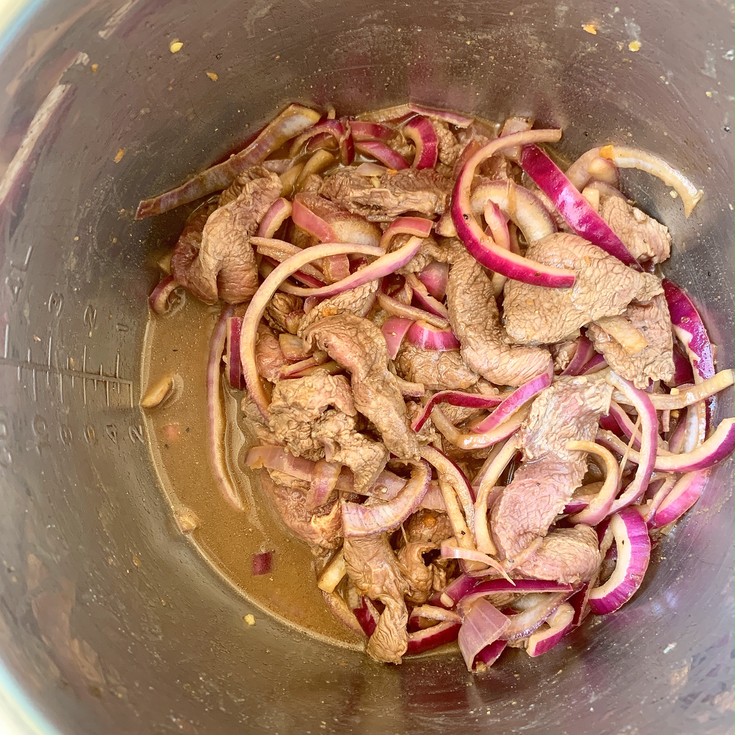 Lomo saltado is Peruvian dish that combines beef stir-fry, french fries and rice. Make this paleo/whole30 version in your slow cooker or Instant Pot.