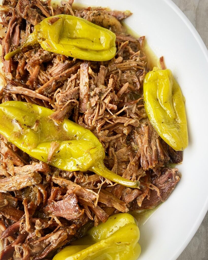 overhead shot of Mississippi roast on a white bowl