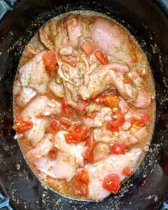before pic of raw, uncooked food in the slow cooker