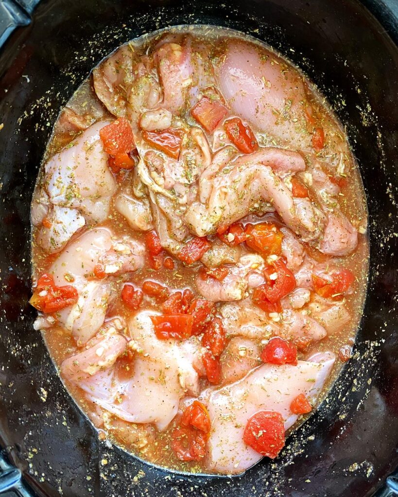 before pic of raw, uncooked food in the slow cooker