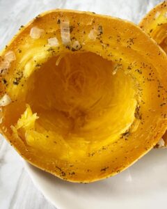 cooked spaghetti squash on a white plate