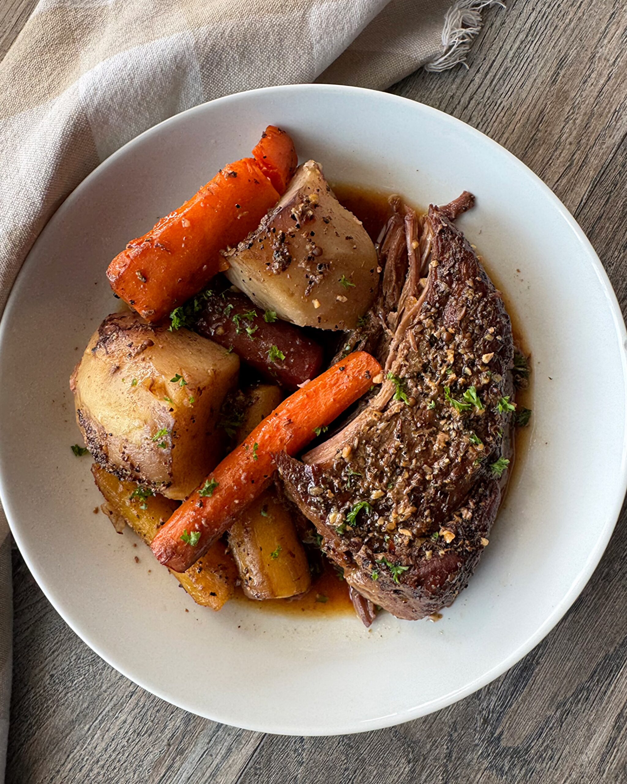 overhead shot of cooked 5-ingredient pot roast a white plate