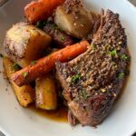 overhead shot of cooked 5-ingredient pot roast a white plate