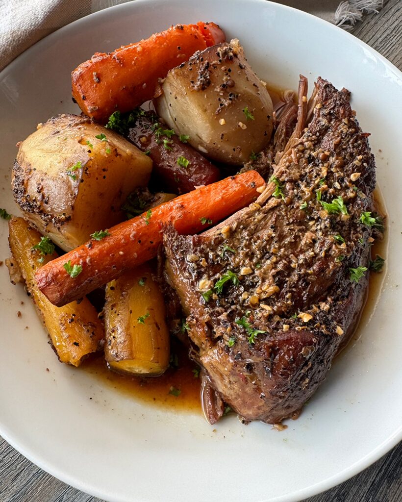 overhead shot of cooked 5-ingredient pot roast a white plate