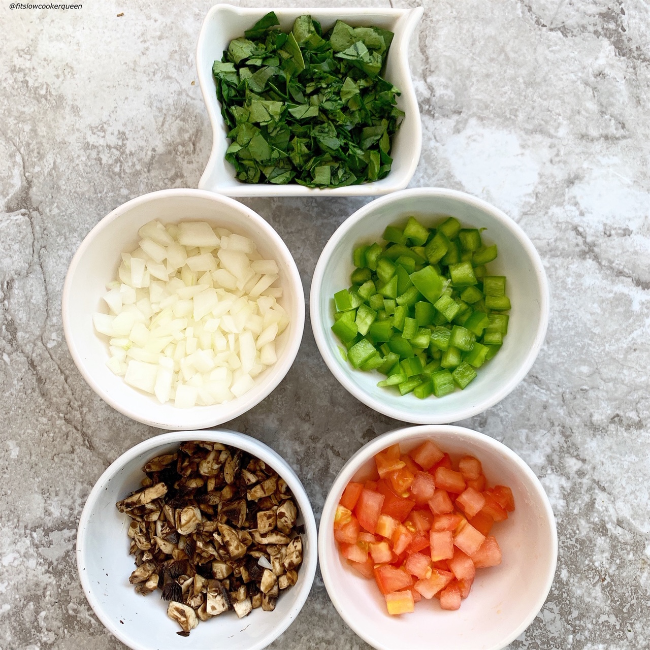 spinach, onion, bell pepper, mushrooms, and tomatoes ready for the {VIDEO} Slow Cooker Meat & Vegetable Frittata (Low-Carb, Paleo, Whole30)