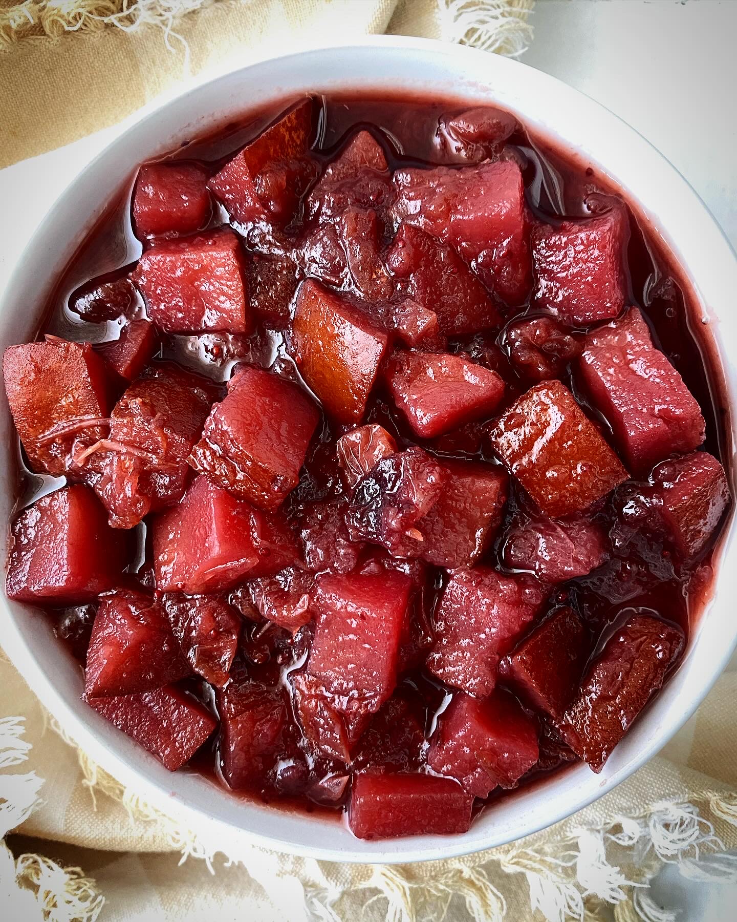 overhead shot of homemade cranberry sauce in a white bowl