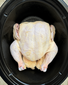 overhead shot of raw, unseasoned whole chicken