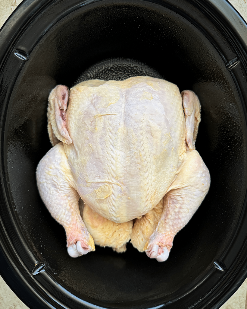 overhead shot of raw, unseasoned whole chicken