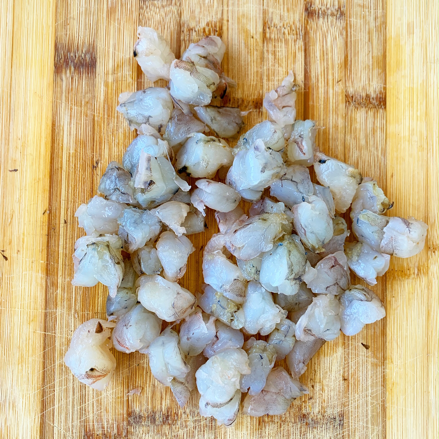 chopped shrimp on a cutting board