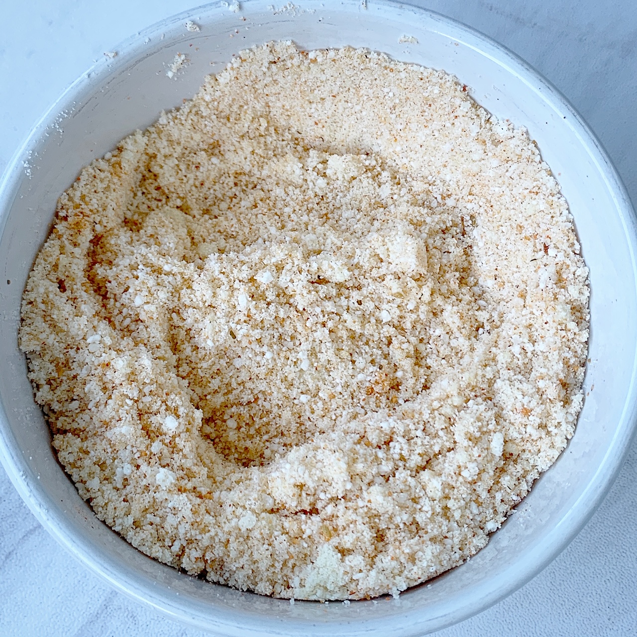 almond flour & Parmesan cheese with Tony Chachere's no salt seasoning in a bowl