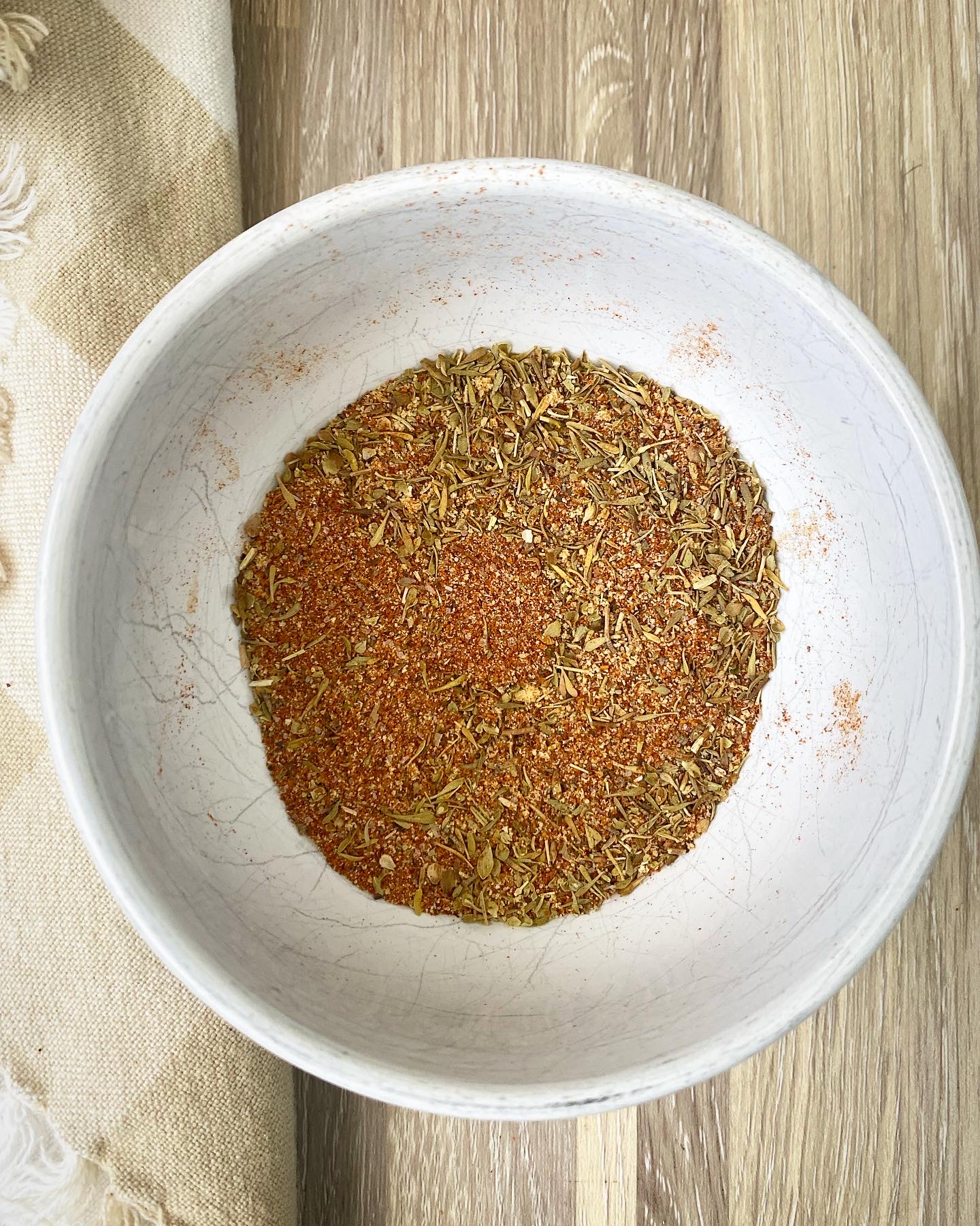homemade Creole seasoning in a white bowl
