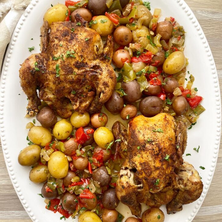 creole Cornish hens on a white platter