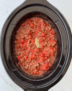 overhead shot of cooked Spaghetti Sauce in a black slow cooker