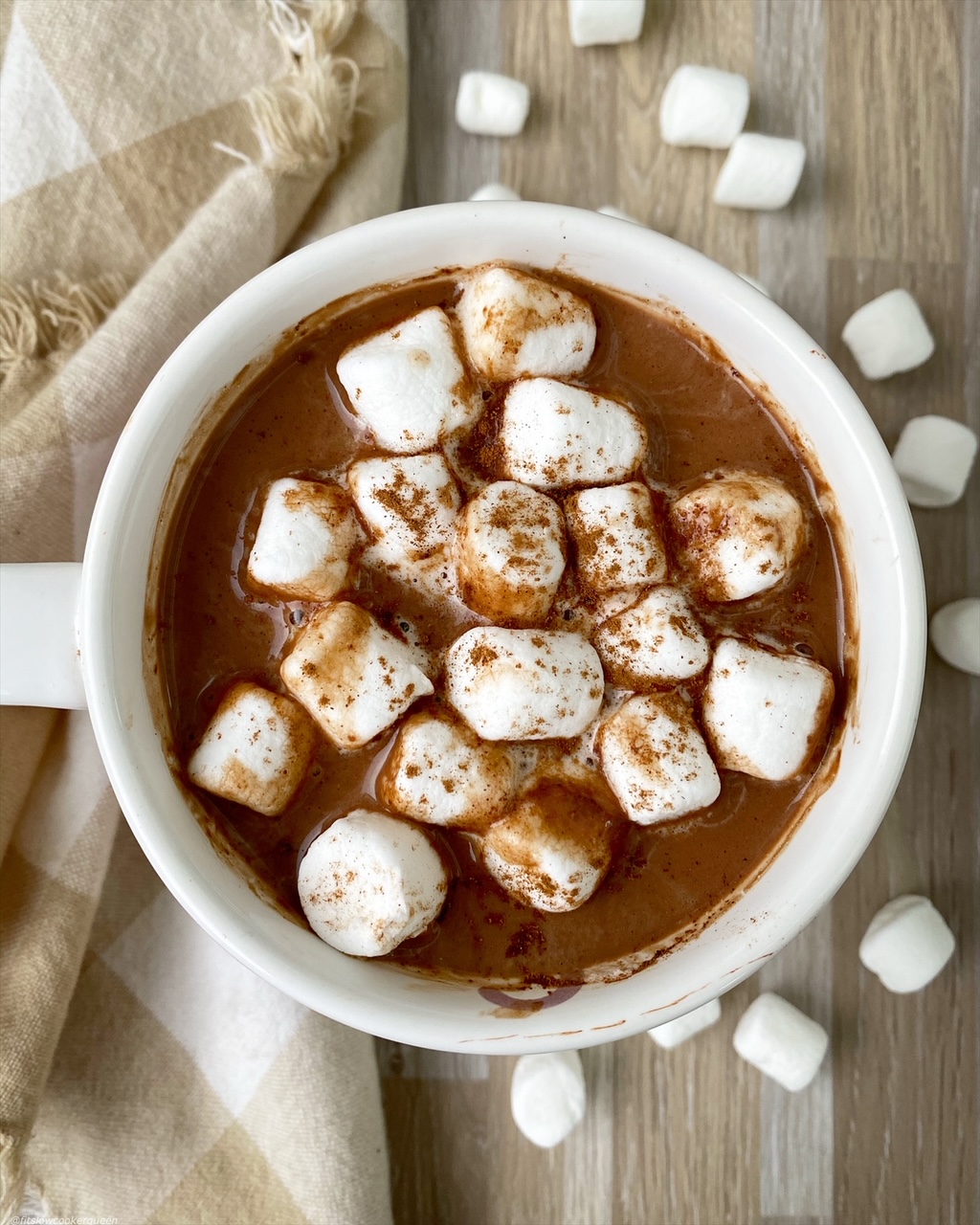 overhead shot of hot chocolate cup topped with marshmellows